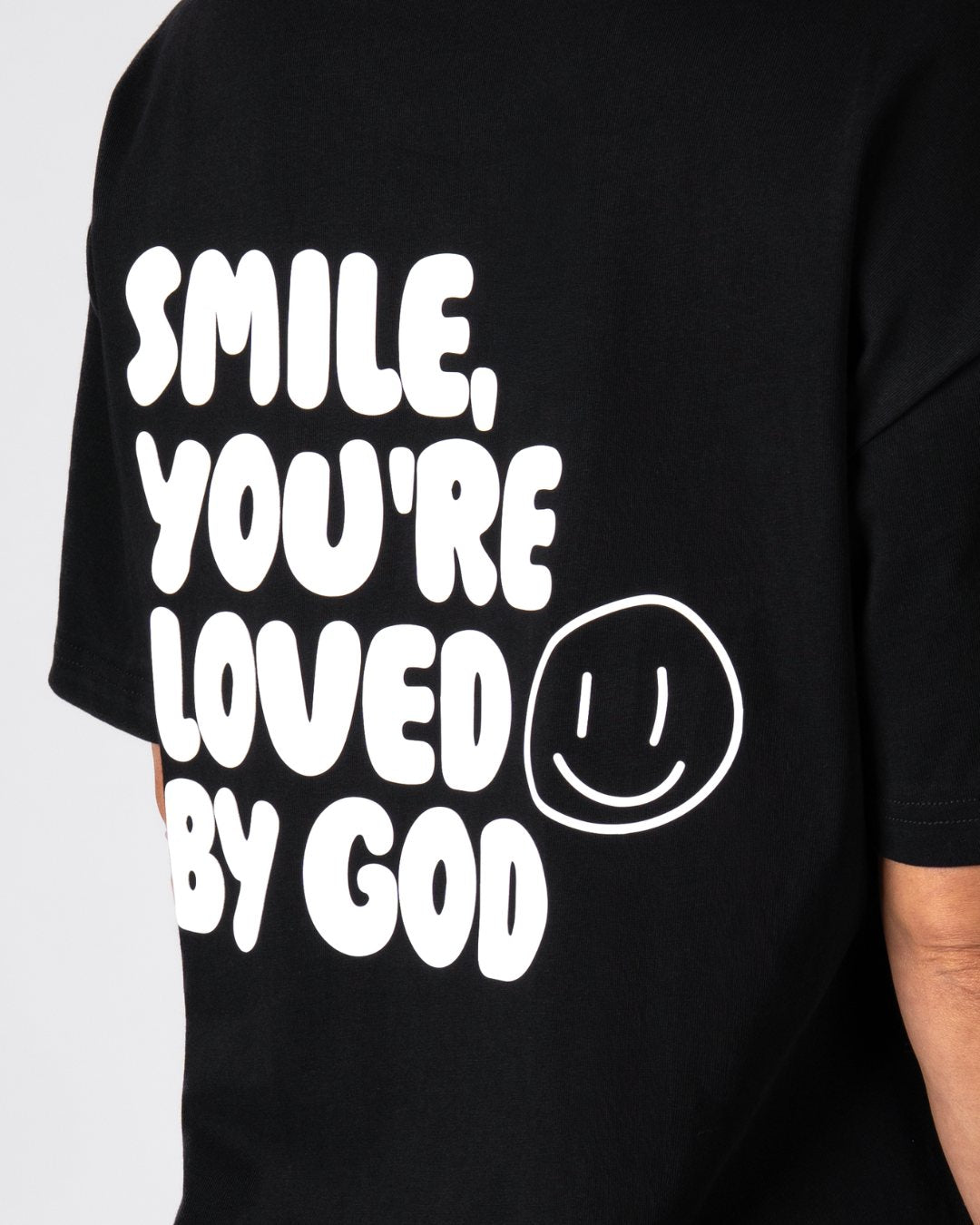 Oversized T-shirt voor dames met de tekst "Loved By God"